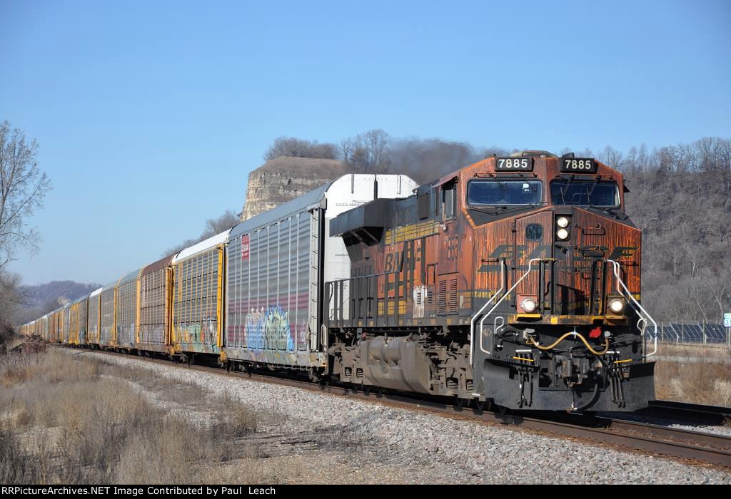 Eastbound vehicle train trails a filthy GEVO